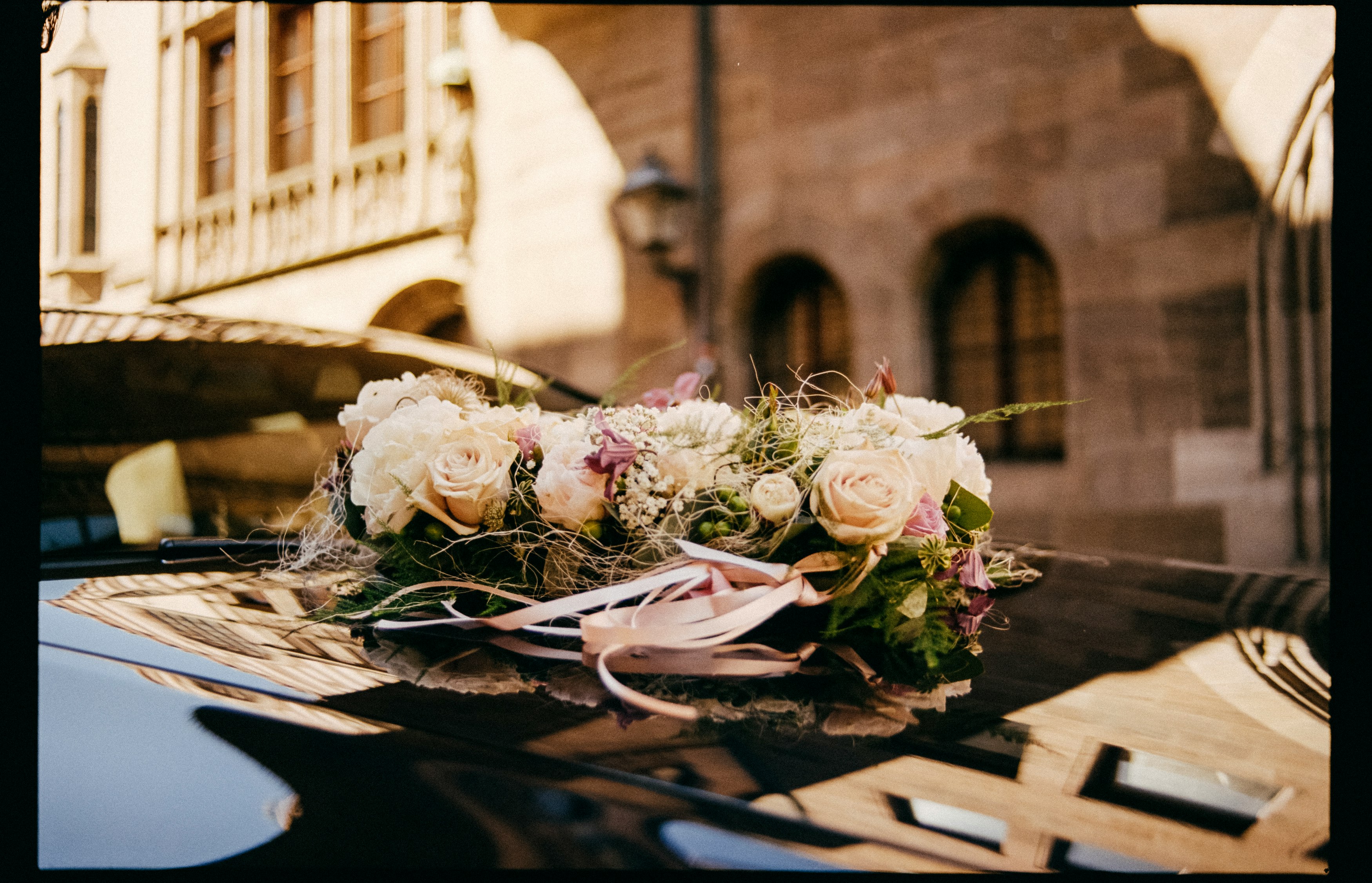 bouquet of white and pink roses on table